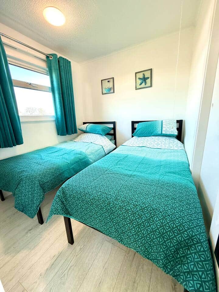 Two single beds in second bedroom