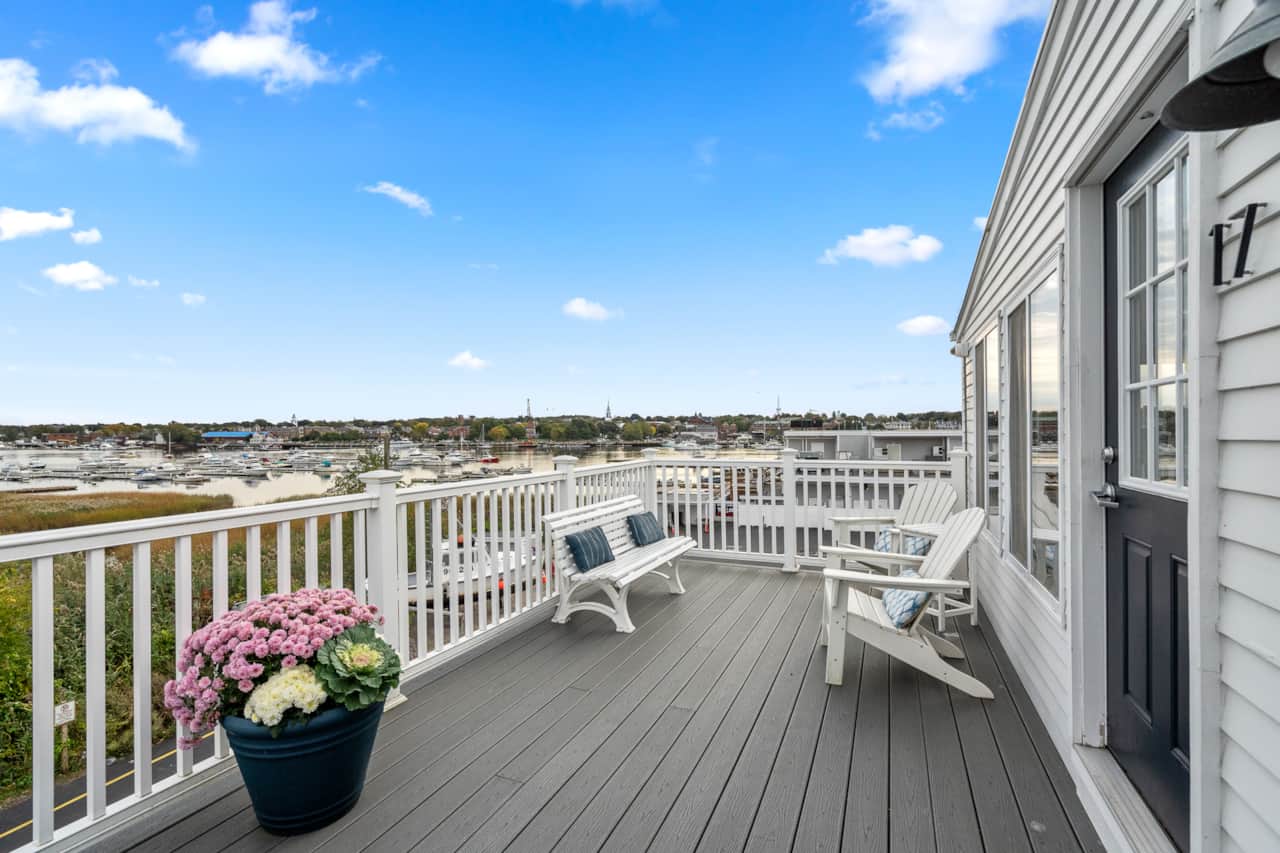 Large Deck overlooking the Merrimack River and Harbor. Access to the unit is located on this deck