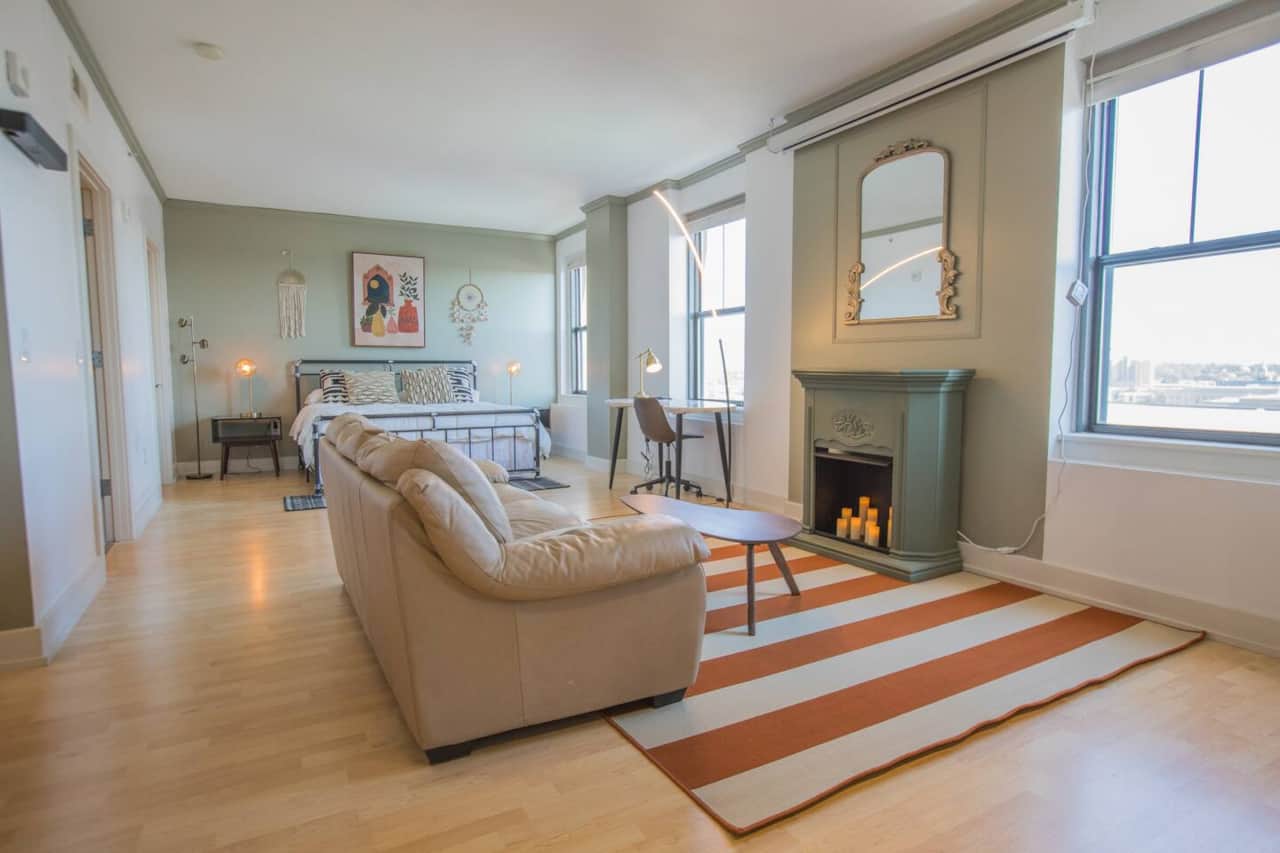 Custom fireplace includes romantic twinkling remote controlled electric candles.