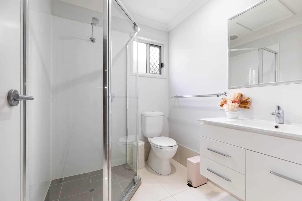 Bathroom: Stylish bathroom with walk-in shower, vanity, and clean finishes 
