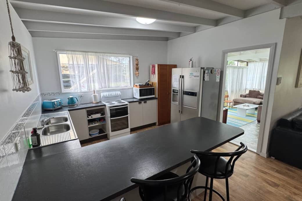 Kitchen leading towards the sunroom.
