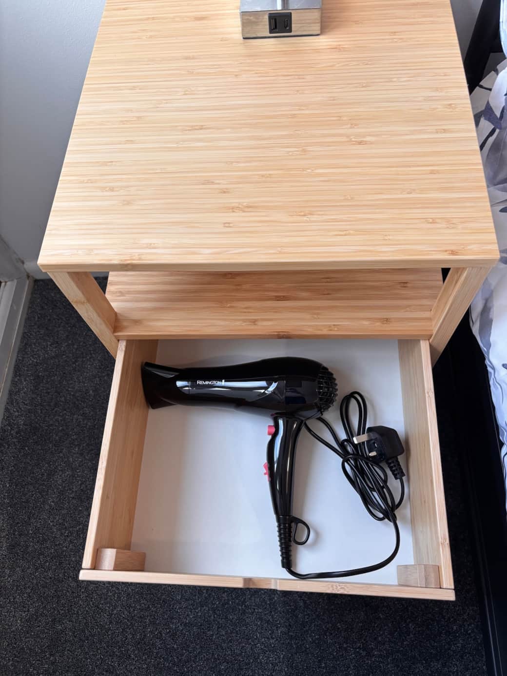 Hairdryer in the bedside table