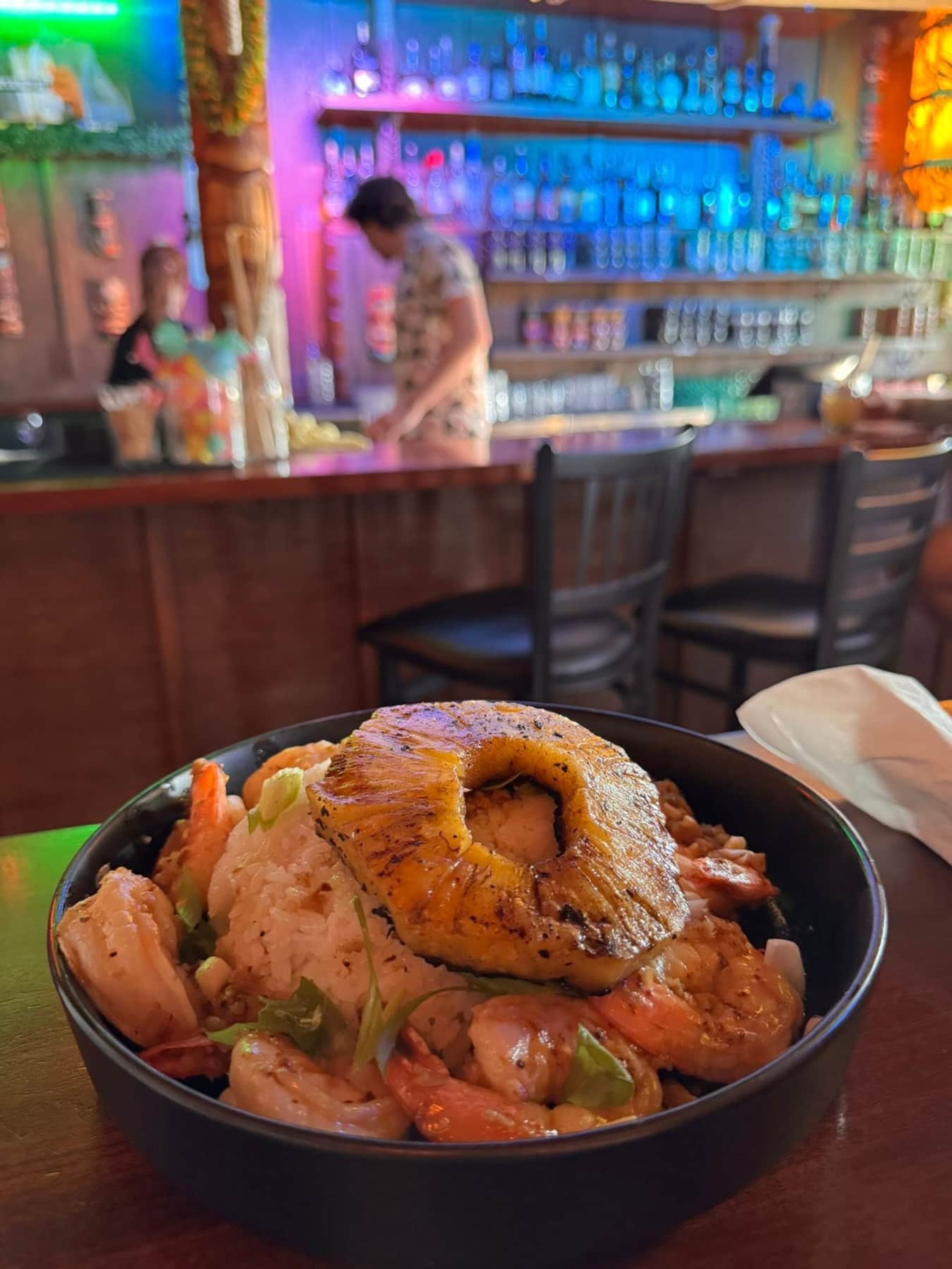Island-style plate and colorful bar at Hidden Peak Tiki Lounge, a favorite Westcliffe restaurant and cocktail spot