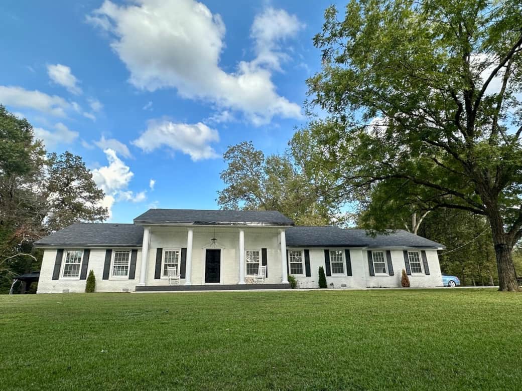 This beautiful estate has a huge front yard!