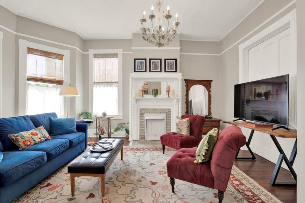 The living room features a comfortable sofa with a pull-out queen bed, a cozy selection of books for your enjoyment, and a flat-screen Sony TV for streaming your favorite shows.