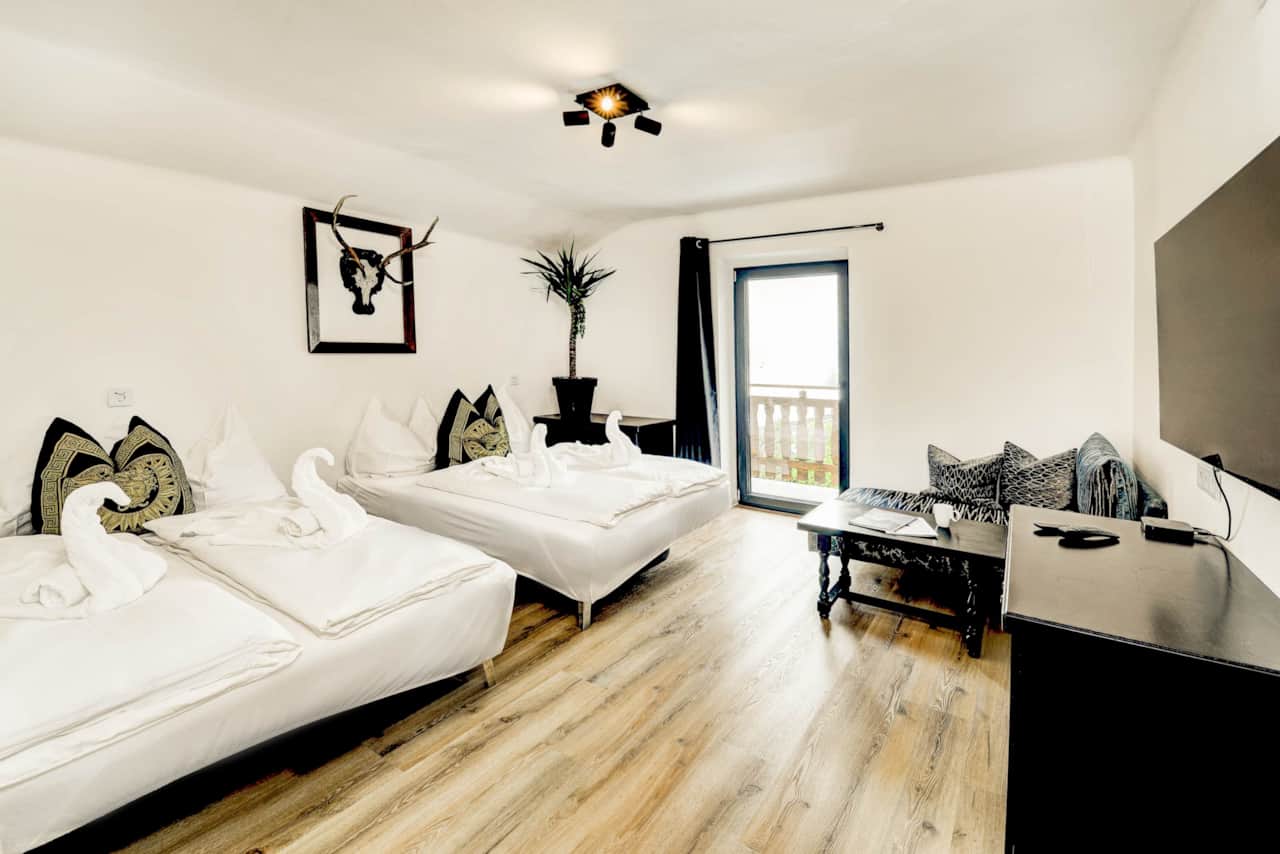 Living room with two sofa beds and TV -  Holiday apartment Das Bergnest.jpg