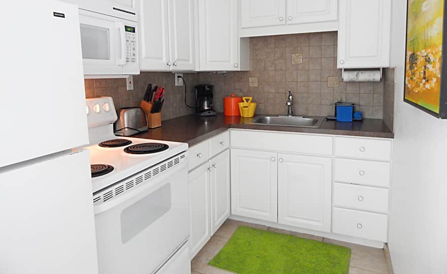 Unit #20 - Kitchen is fully equipped with appliances and utensils to complete a full meal.