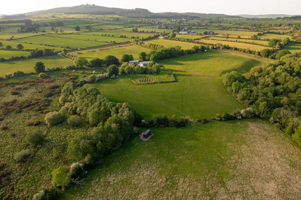 Aerial tigin cabin golden hour wicklow countryside