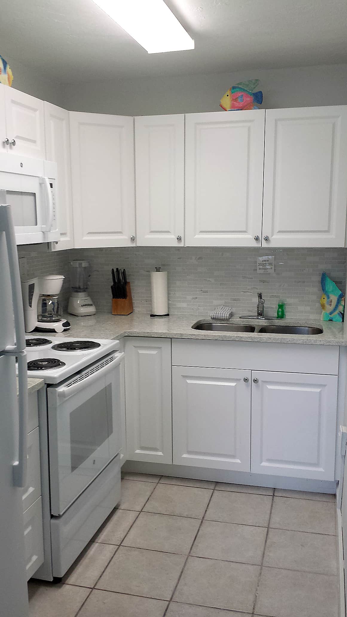 Unit #6 - Kitchen stocked with everything you need to prepare a complete meal.