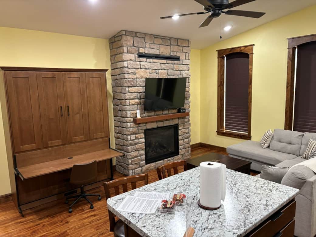 Limestone Lodge Apt A Living Area w/Fireplace & Murphy Bed Desk