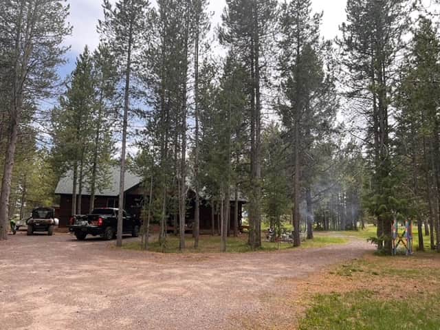Cabin is set back in the trees and off the road with plenty of parking. Cabin is set back in the trees and off the road with plenty of parking.