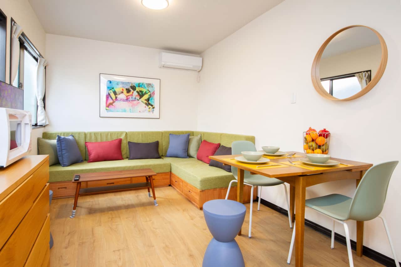 Relax on the spacious, colourful lounge after a day in Tokyo.