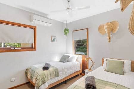 The perfect fun bedroom for the children with two single beds and extra large built in cupboards.