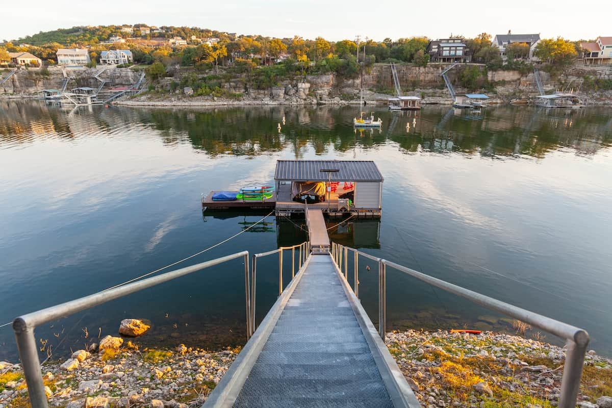 Private covered dock and boat slip just steps from the home