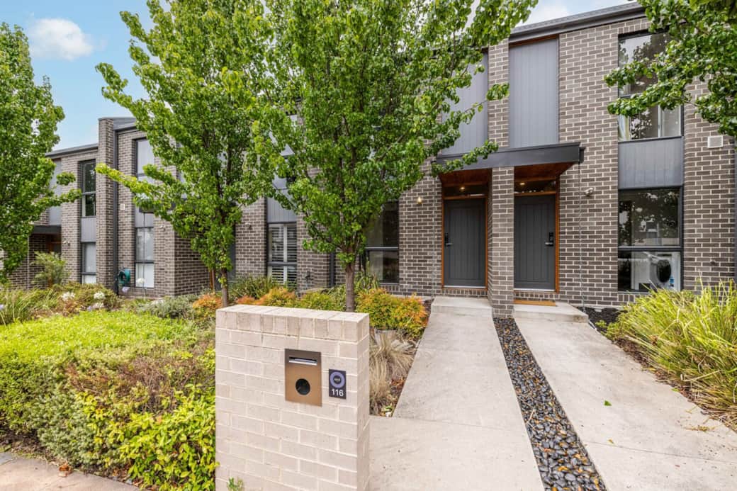 Welcome to our contemporary urban abode, a perfect blend of modern design and comfort. The brick facade and lush greenery create a striking first impression. The well-maintained exterior reflects the care and attention given to every detail inside. 
