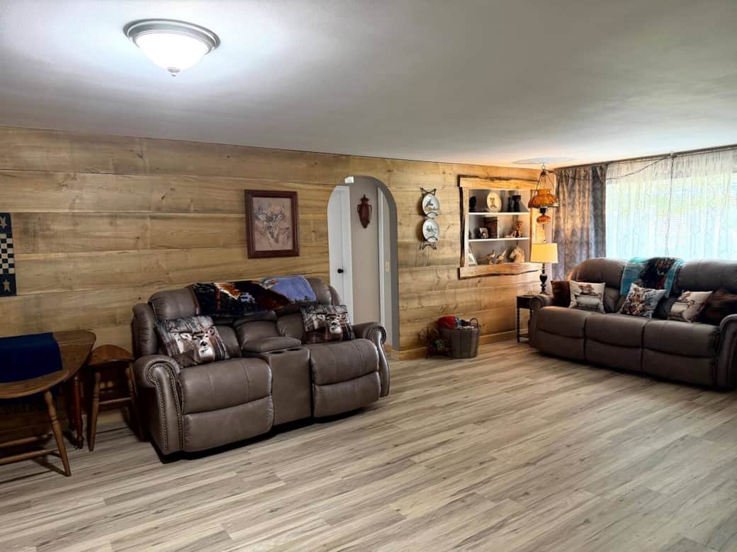 Gather the whole group — the living room seats everyone comfortably. 