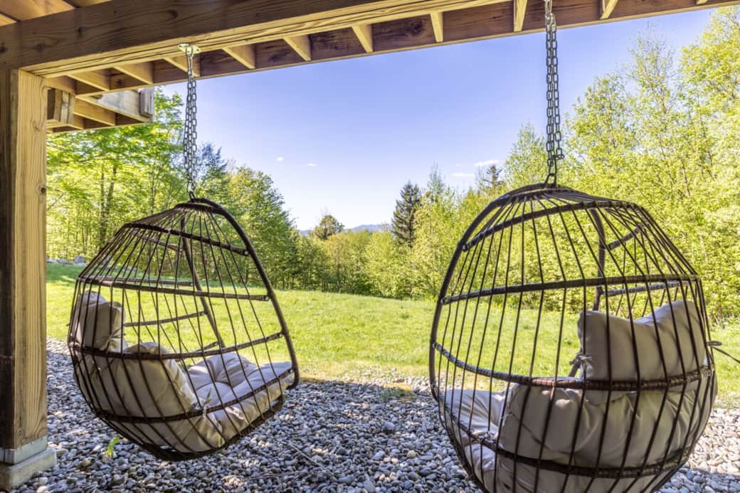 Relax in these cozy hanging chairs—perfect for a morning coffee or unwinding after a day outdoors.