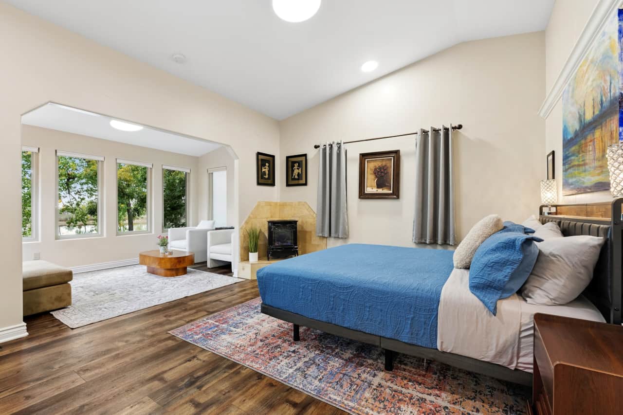 Primary bedroom — California king, gas fireplace, sitting area