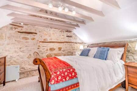 Cherry wood Sleigh bed with luxury bedding