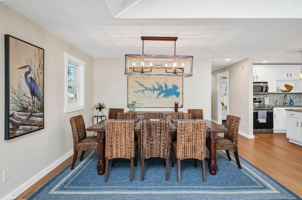 Large dining table with leaf available to extend to accommodate 10 guests.