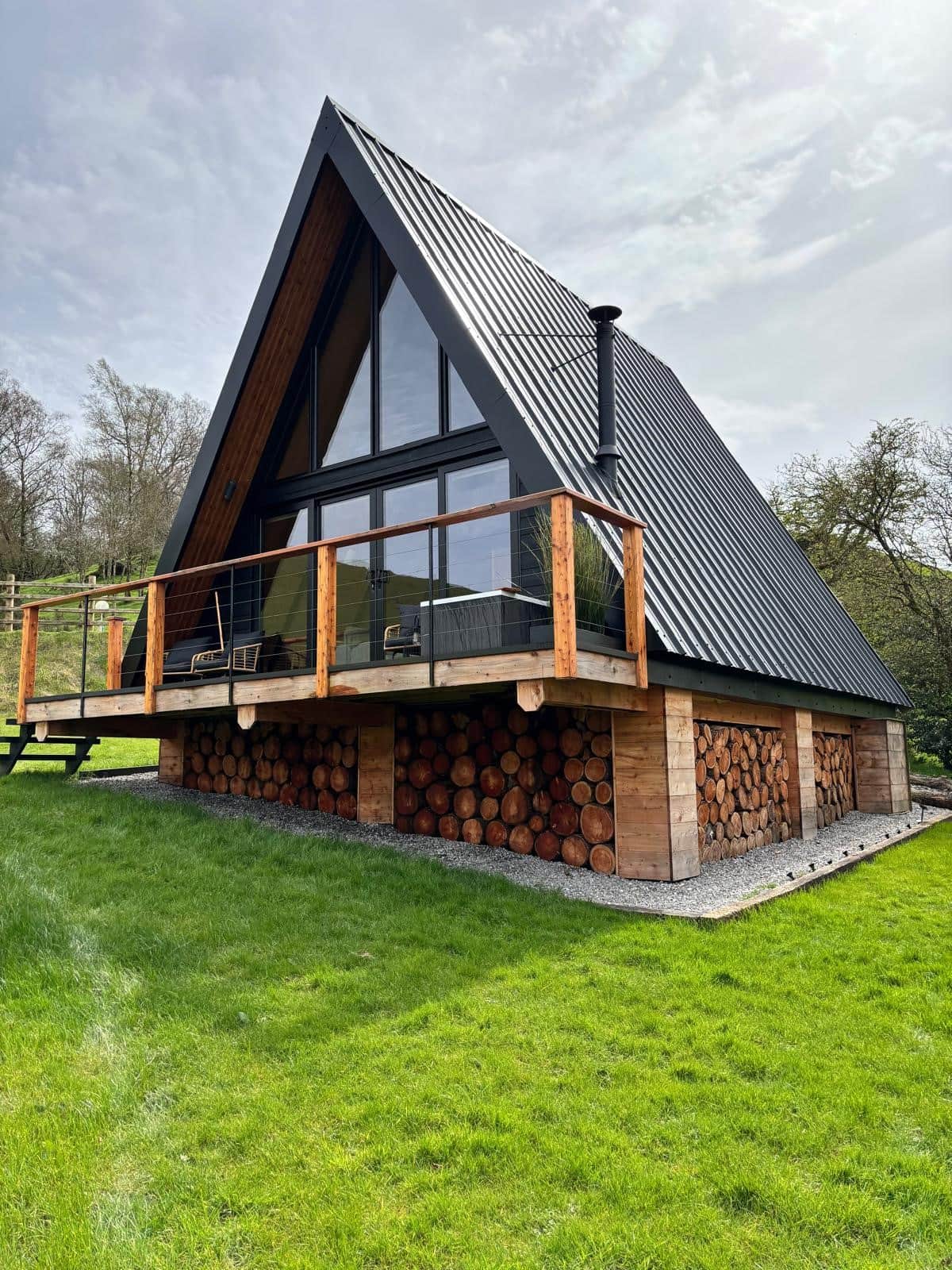 Sigrid Lodge exterior, modern A-frame architecture with wood accents.