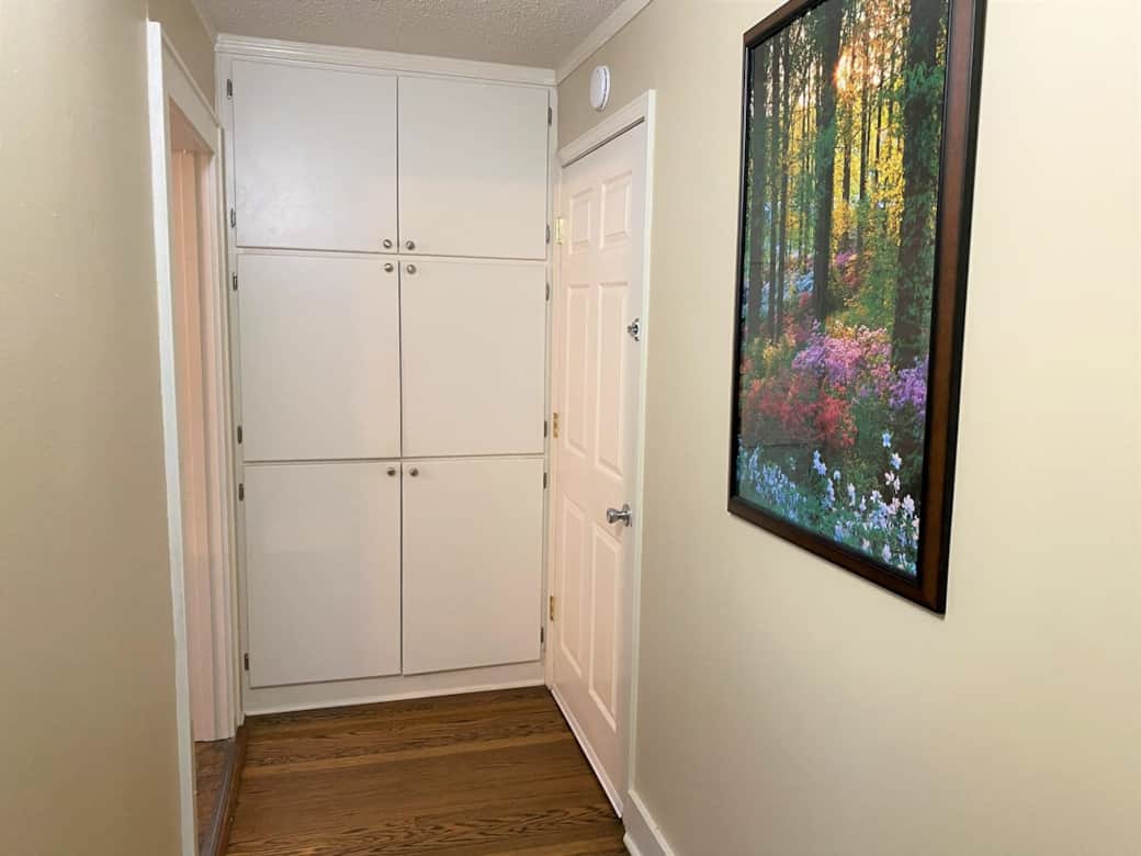 Extra-large pantry is located between the two kitchens for the House and the Apt. The door on the right is the Apt entrance that can be locked on both sides or open to share the entire space.