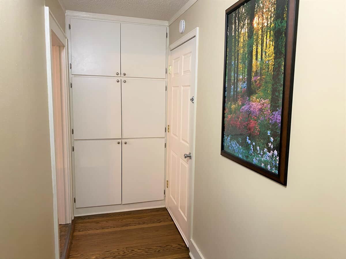 Extra-large pantry is located between the two kitchens for the House and the Apt. The door on the right is the Apt entrance that can be locked on both sides or open to share the entire space.