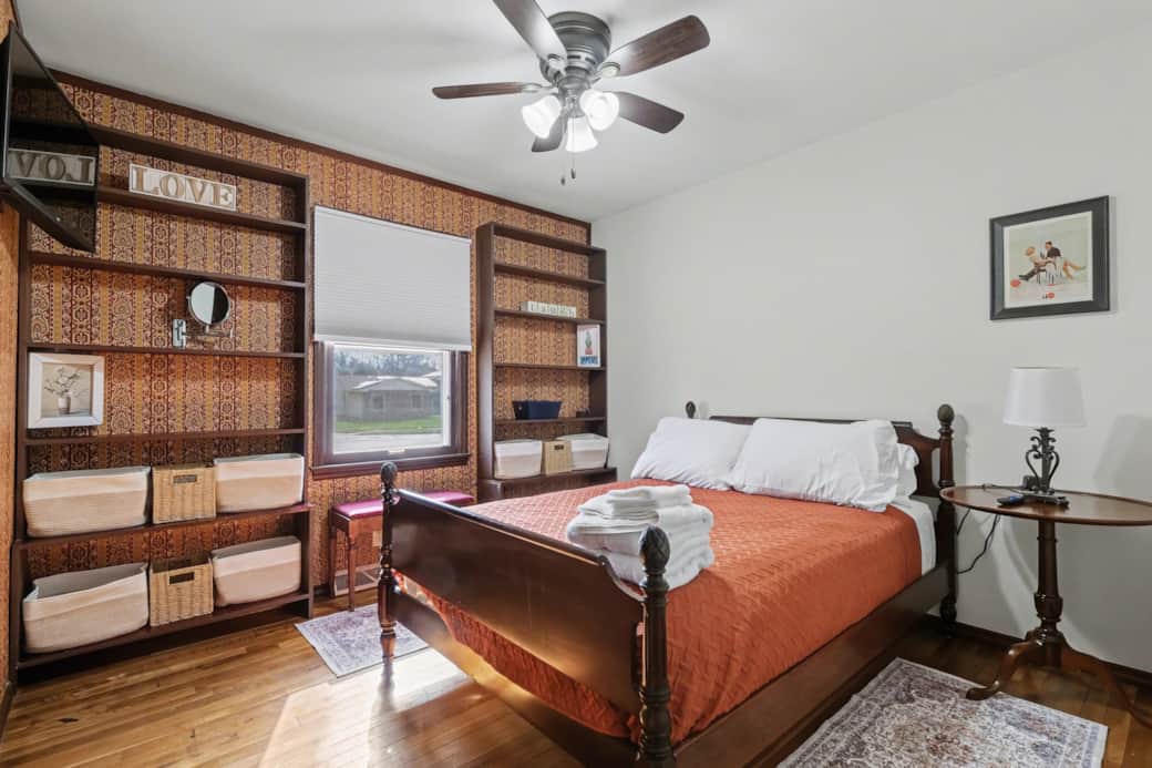 Orange Room - Full size bed, storage in the built-in shelves, Roku TV and power for your devices.