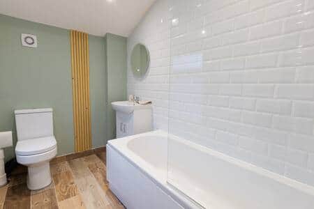 Bathroom which includes both a bath and shower