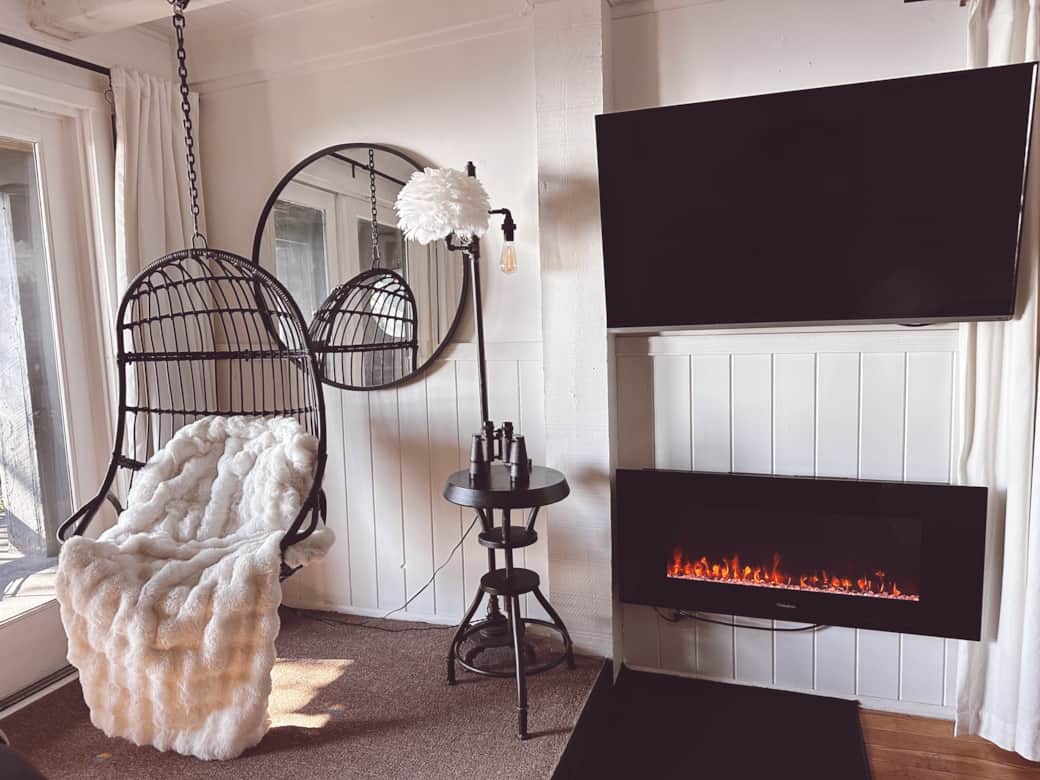 Chic cozy hanging chair fireplace binoculars