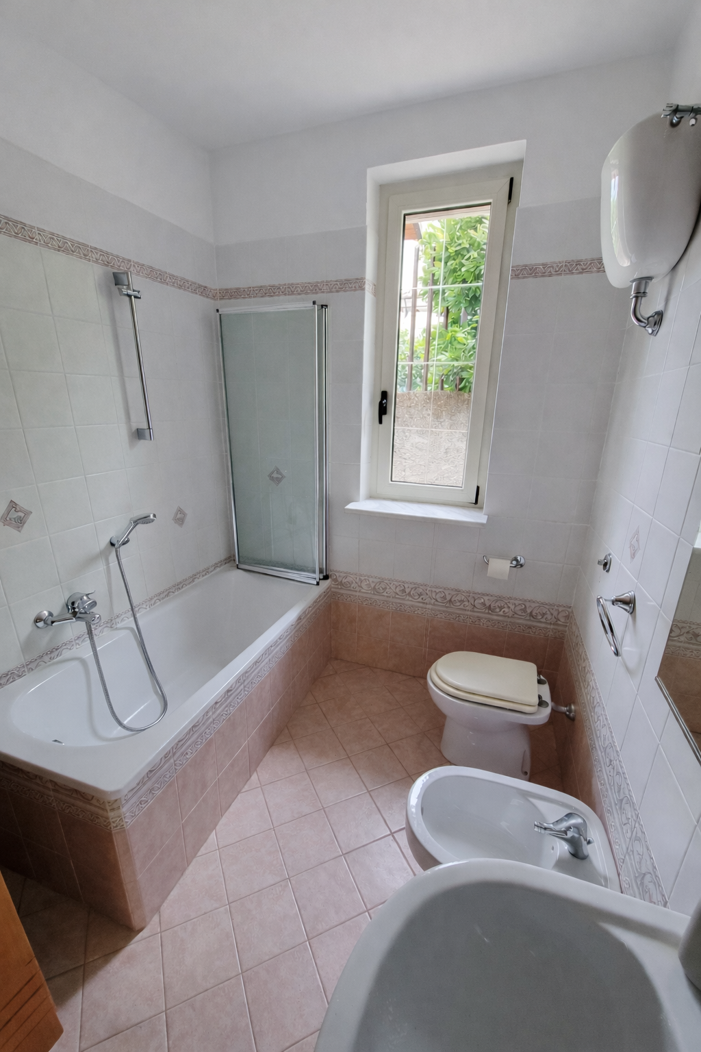 Main bathroom with bathtub, shower and bidet