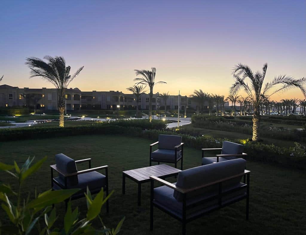 Garden with outdoor furniture and sea view 
