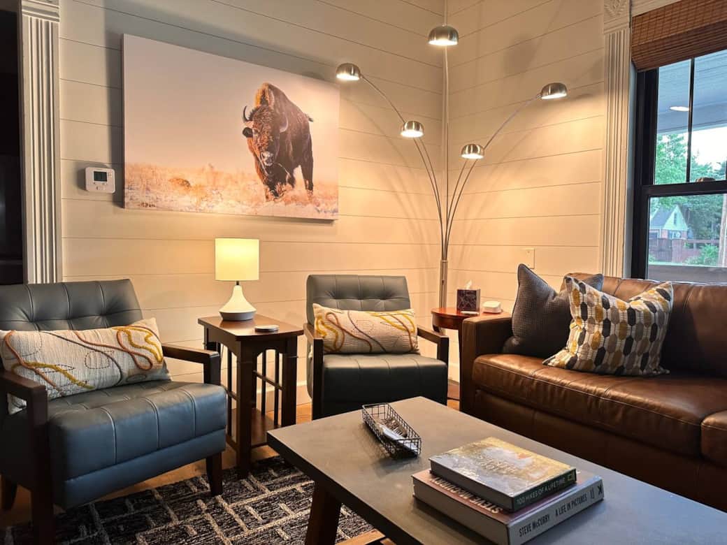 Bold bison artwork anchors the room with character.