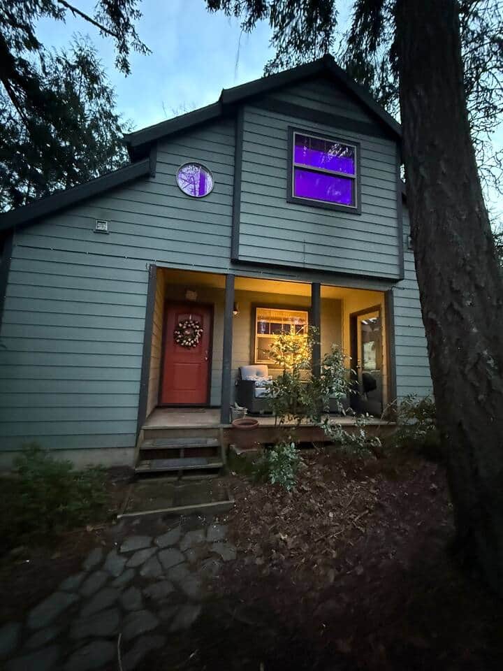 Unwind on the cozy front patio as the evening settles in, the perfect spot to enjoy a glass of wine.