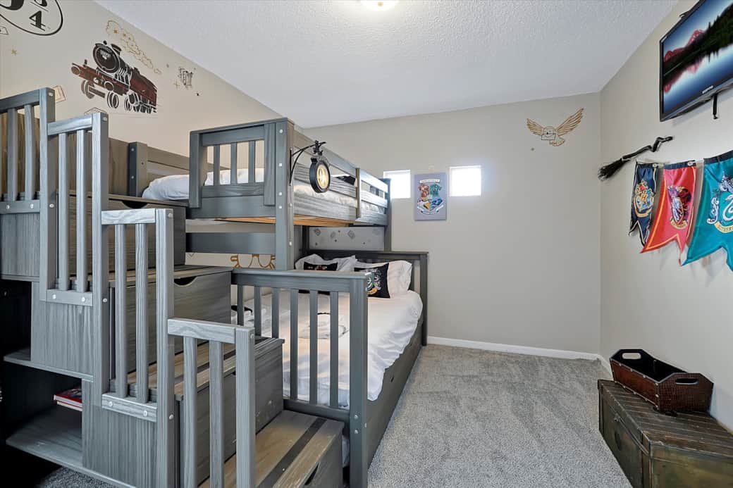 Welcome Wizards!  Second floor bedroom w/ full-sized bottom bed, twin-sized top bed, & twin trundle
