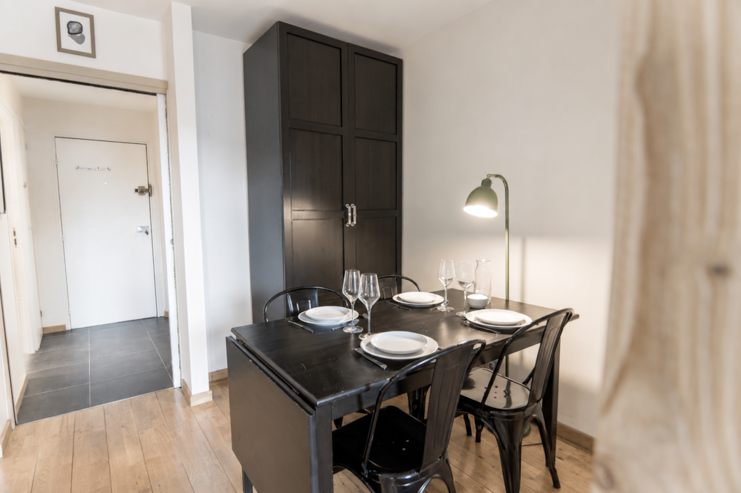 The dining area features an extendable table for added comfort and convenience.