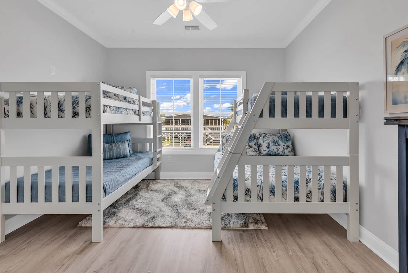 Bedroom with full bed and three twin beds