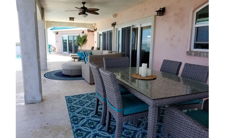 Outdoor dining area on the pool patio
