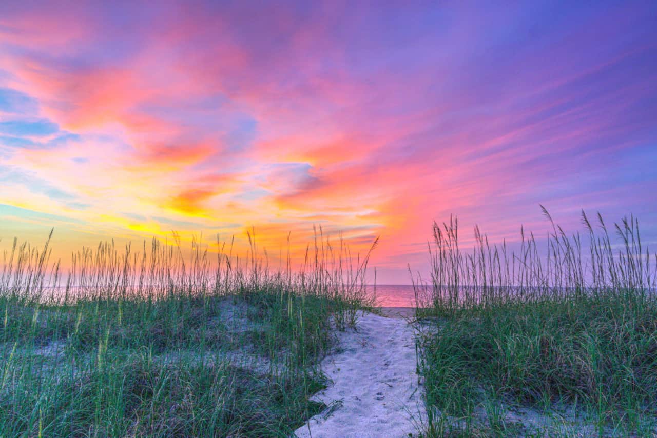 Sunrise over dunes by Katrina Baxter