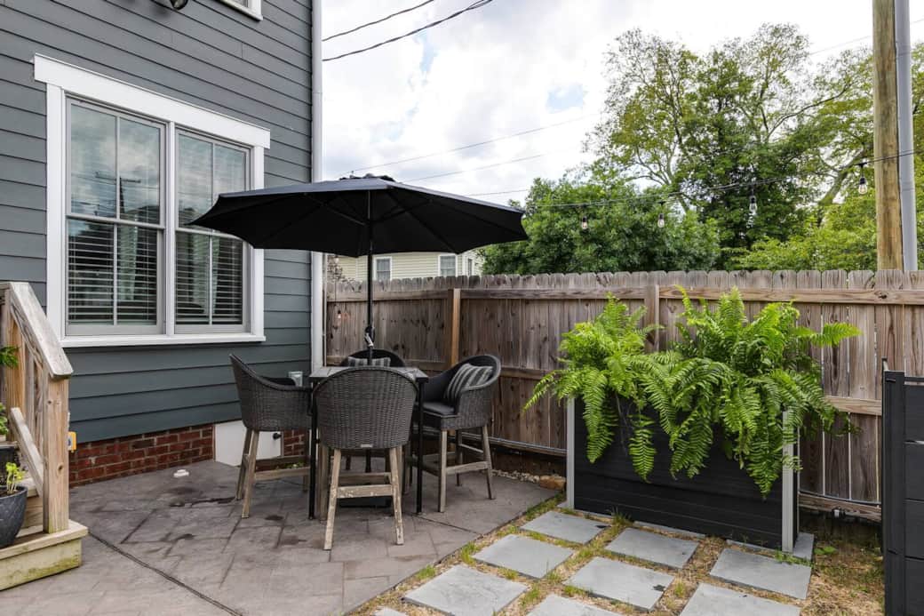 Stamped concrete patio with high-top table. (We're working on the grass!)