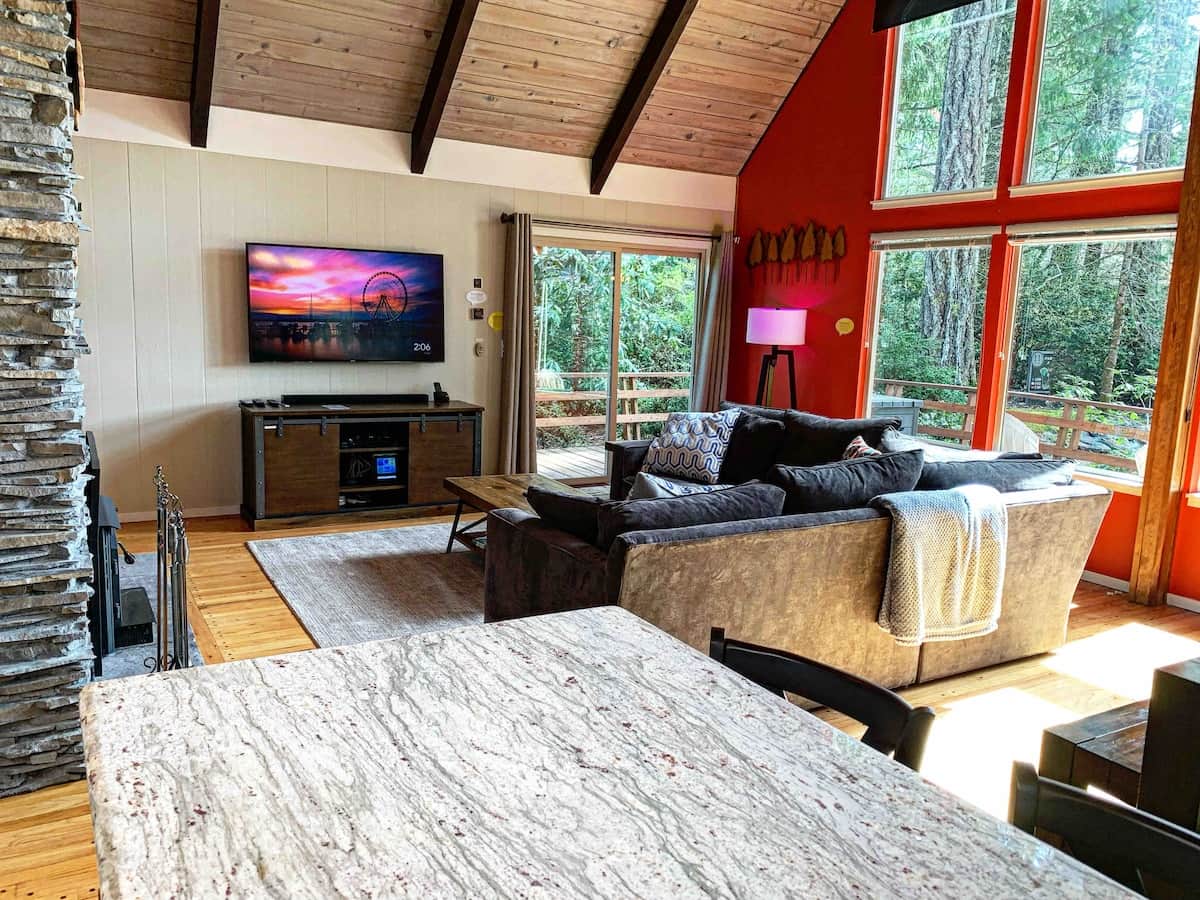 Living room with a 65” Smart TV.  
YouTube TV, Disney+, and Hulu are complimentary.  