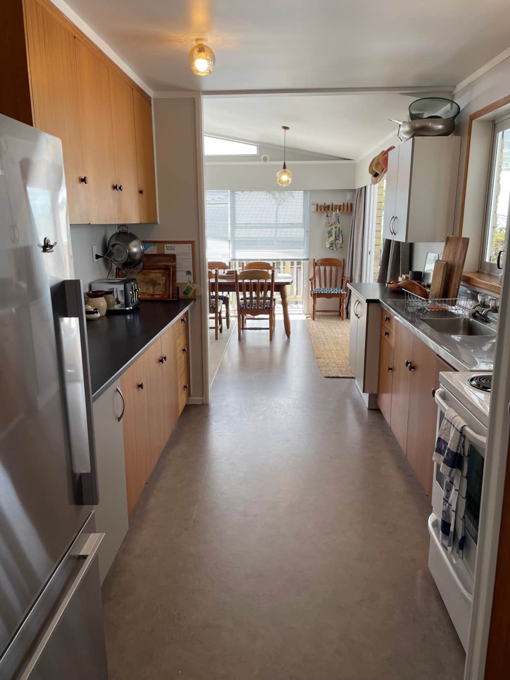 Old school 1970s veneer galley kitchen.