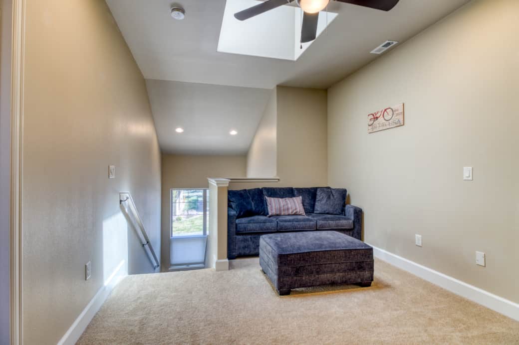 Skylit loft with sofa bed, TV, and games – flexible hangout or sleeping space