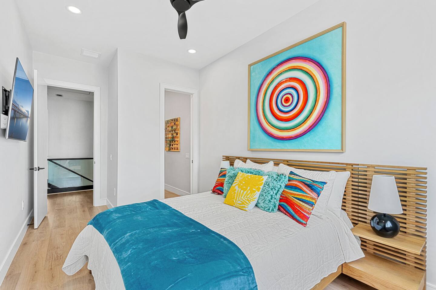 Bright colors along with a king size bed, make this bedroom perfect for relaxing.