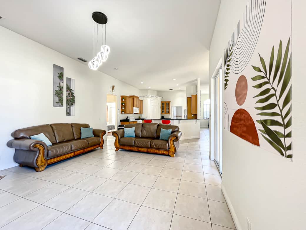 Inviting full kitchen area, complete with stylish bar stools and ample seating for large groups.