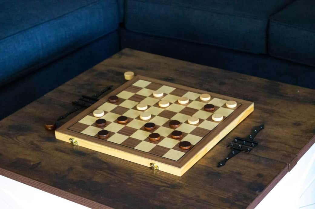 Inside this coffee table are many games for the family to enjoy.