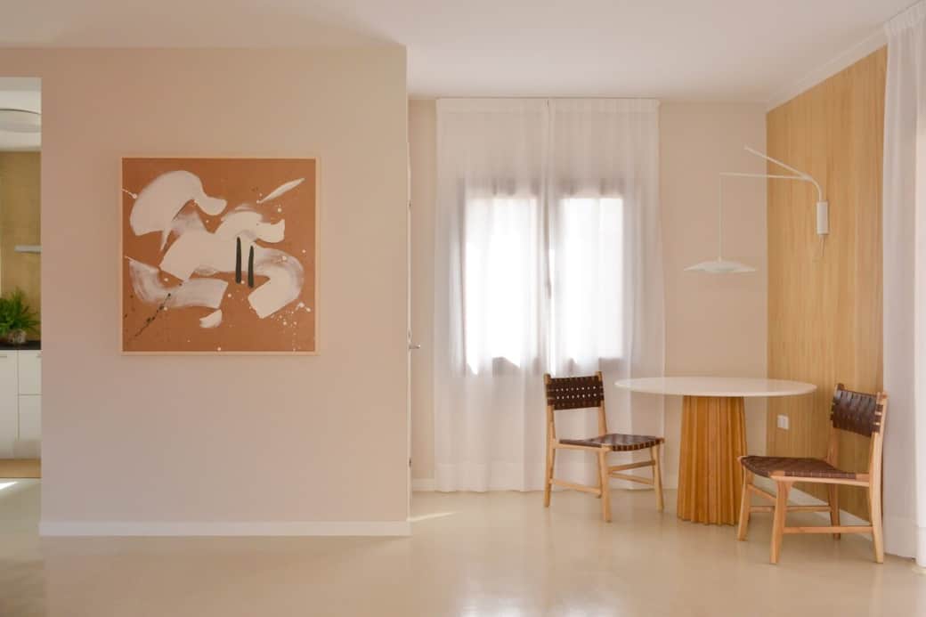 Dining area, custom-designed table, original abstract artwork. Dining area, custom-designed table, original abstract artwork.