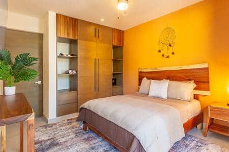 Master bedroom oasis: wardrobe wall closet, safe, AC for perfect comfort.