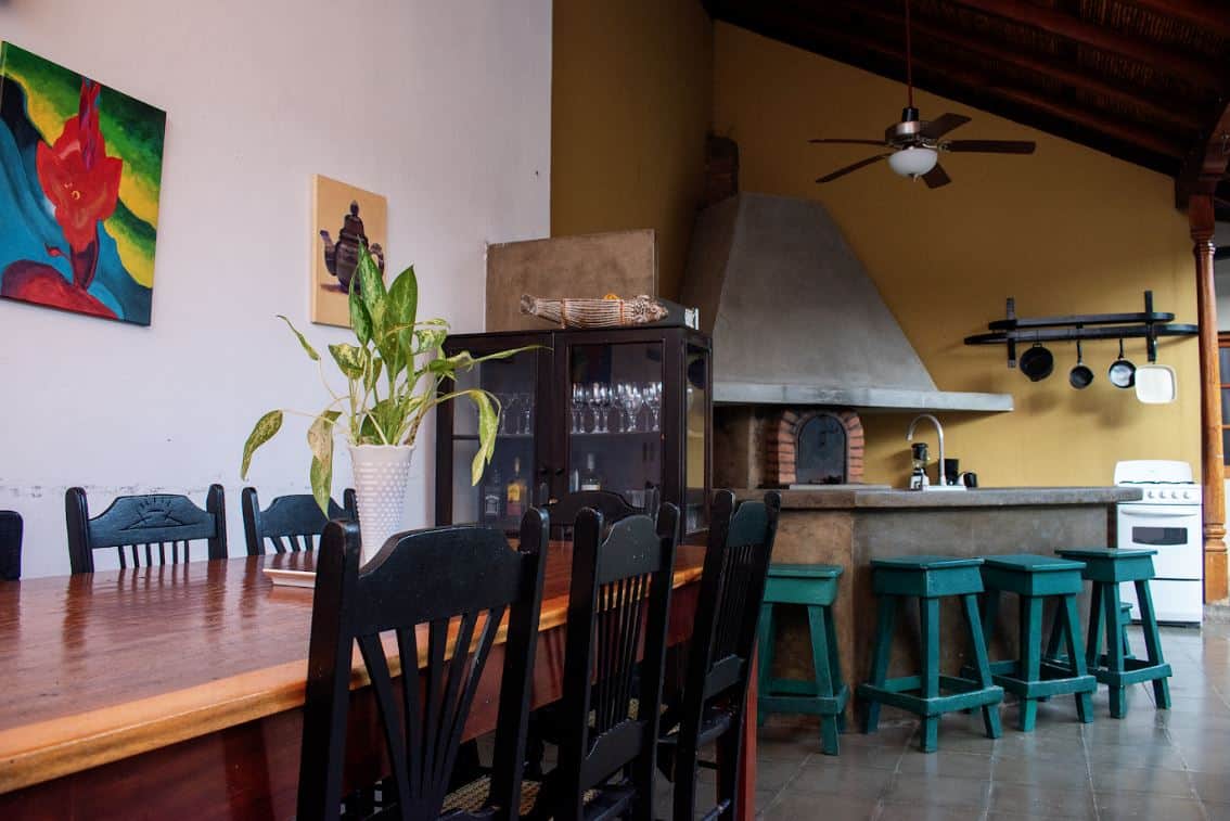 Full kitchen and long dining table for groups at a whole-house rental in Granada, Nicaragu