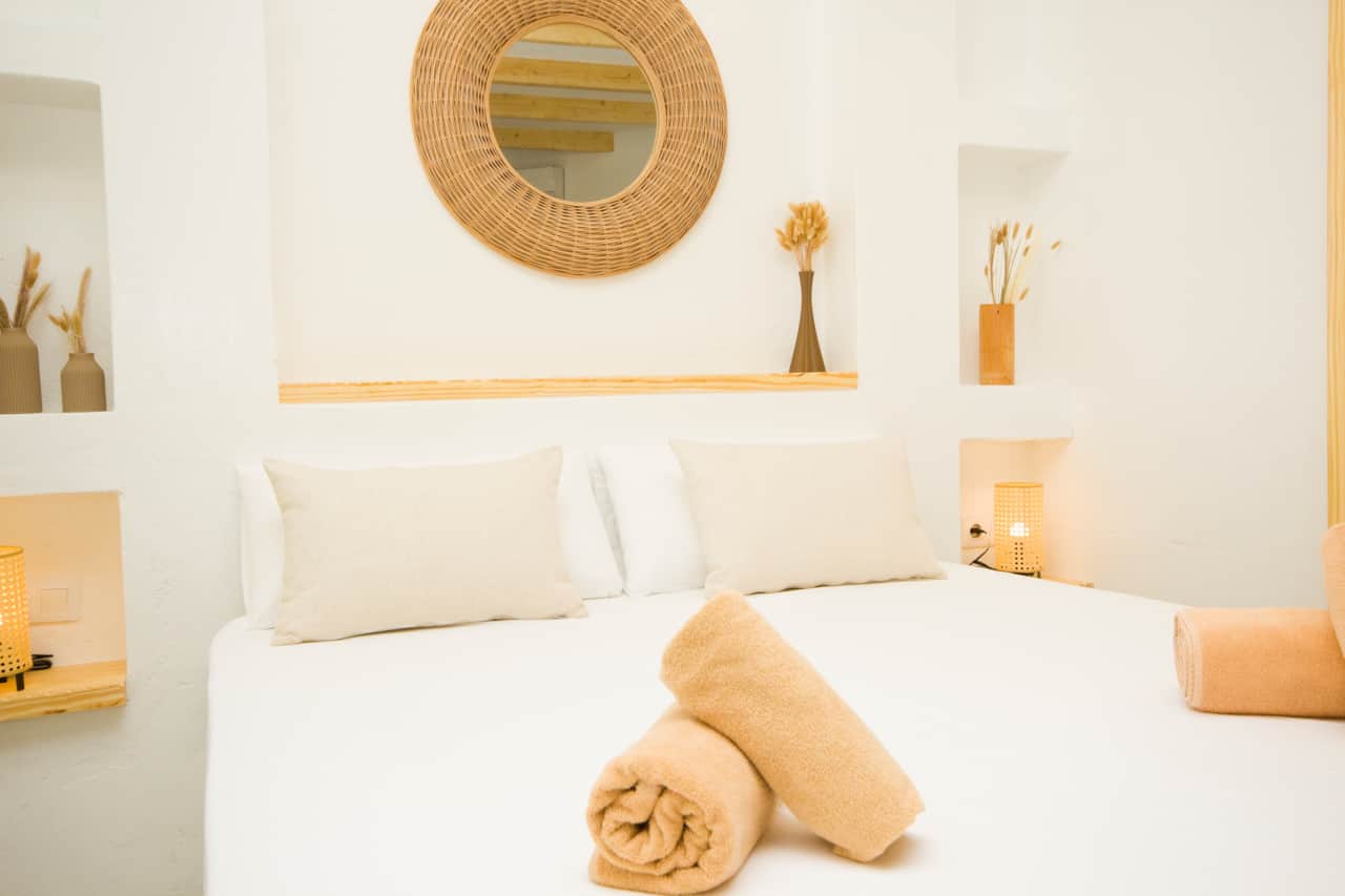 Bedroom with a double bed and modern décor at El Charco Lofts 4